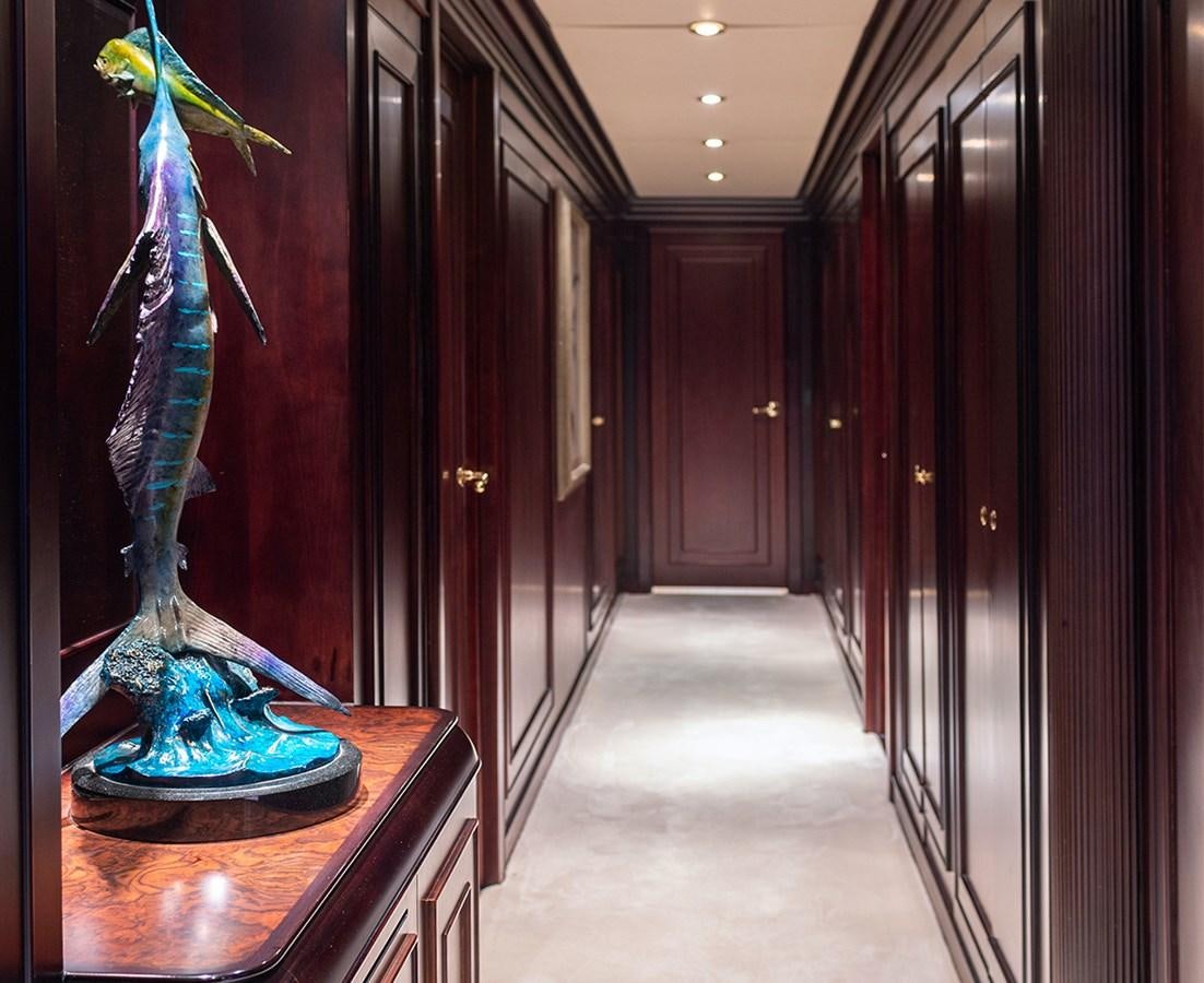 a blue and gold statue in a hallway aboard LIBERTA Yacht for Sale