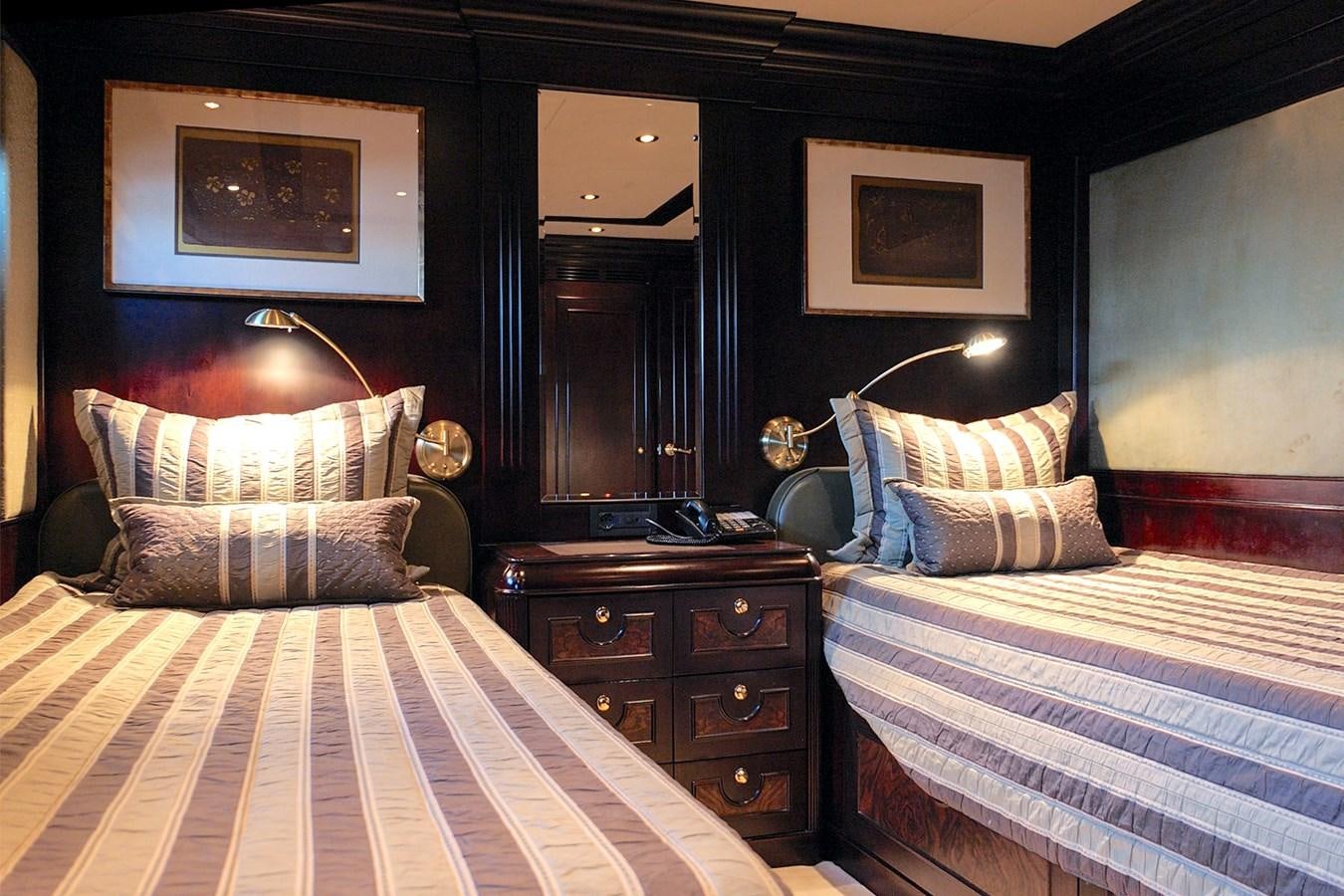 a bedroom with two beds aboard LIBERTA Yacht for Sale