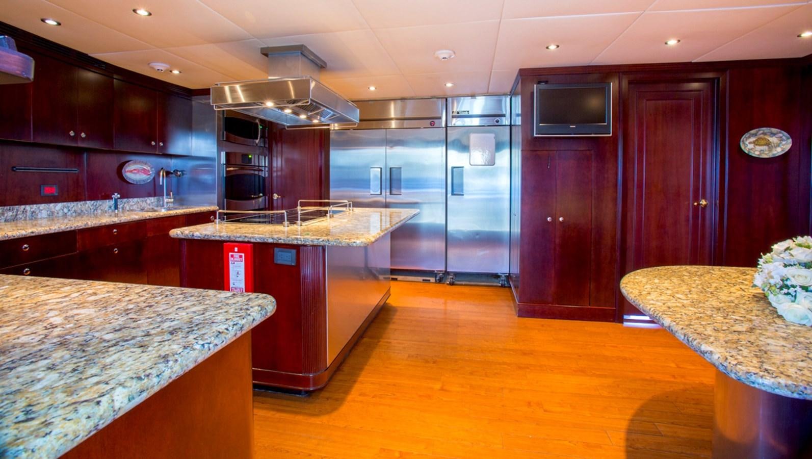 a kitchen with a large island aboard LIBERTA Yacht for Sale
