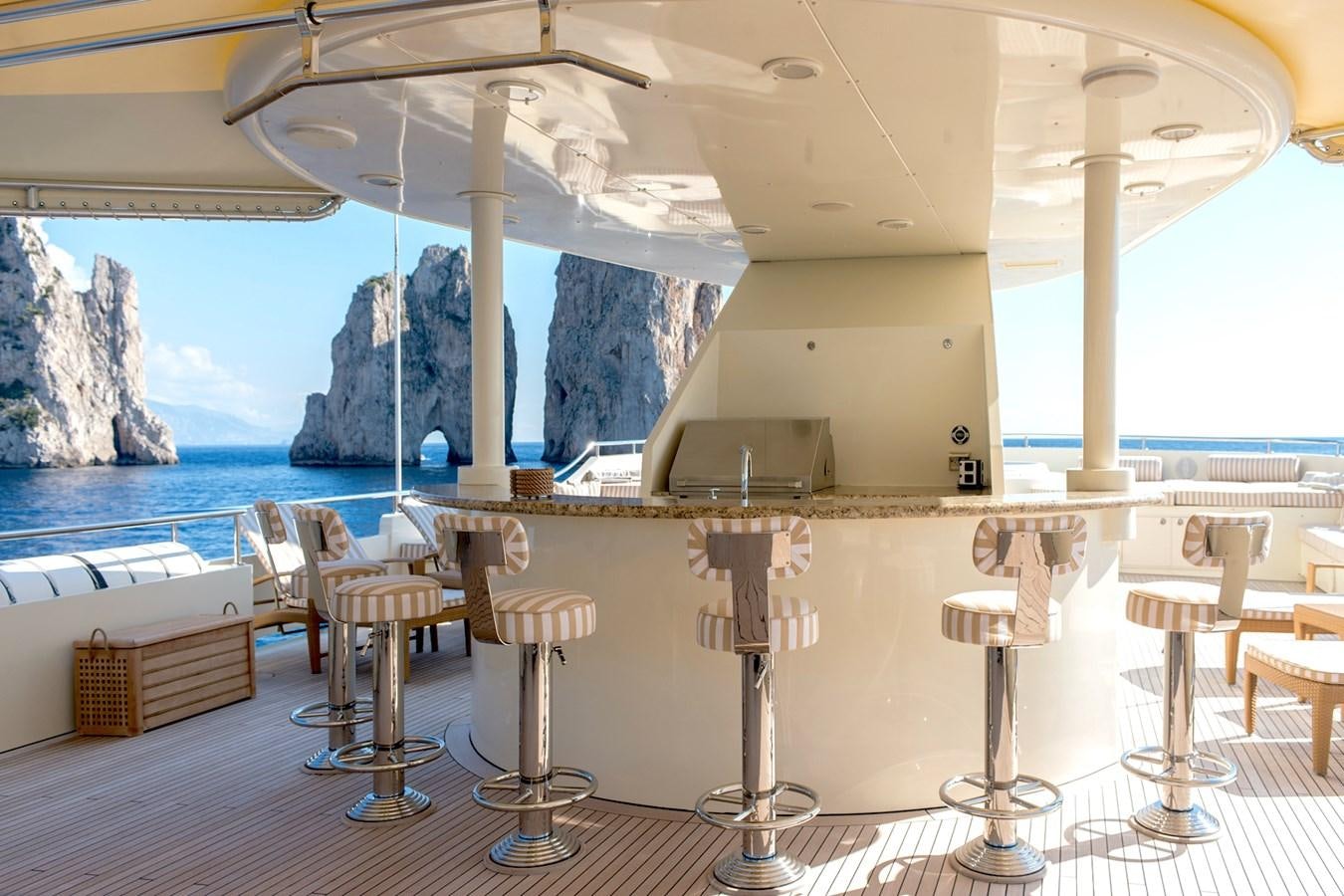 a room with tables and chairs aboard LIBERTA Yacht for Sale