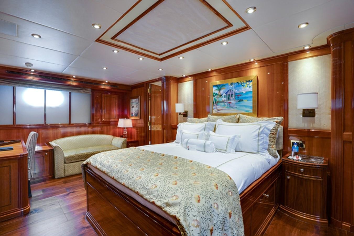 a large bedroom with a large bed aboard TEMPTATION Yacht for Sale