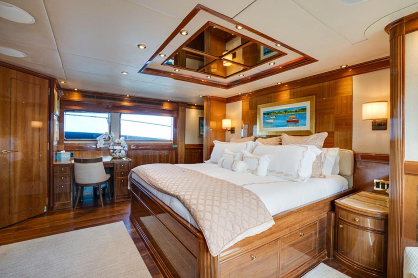 a large bed in a hotel room aboard TEMPTATION Yacht for Sale