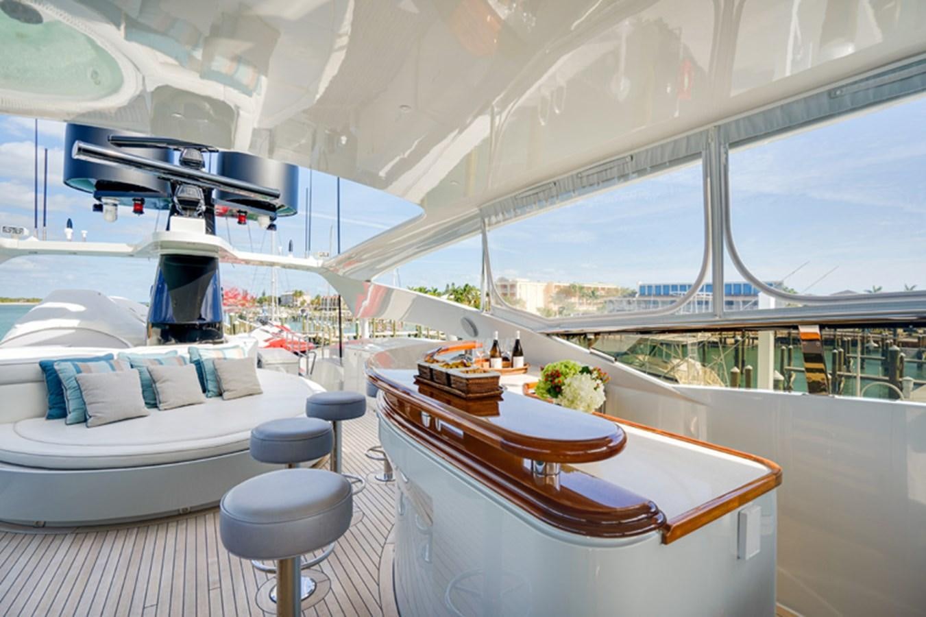 a room with a table and chairs aboard TEMPTATION Yacht for Sale