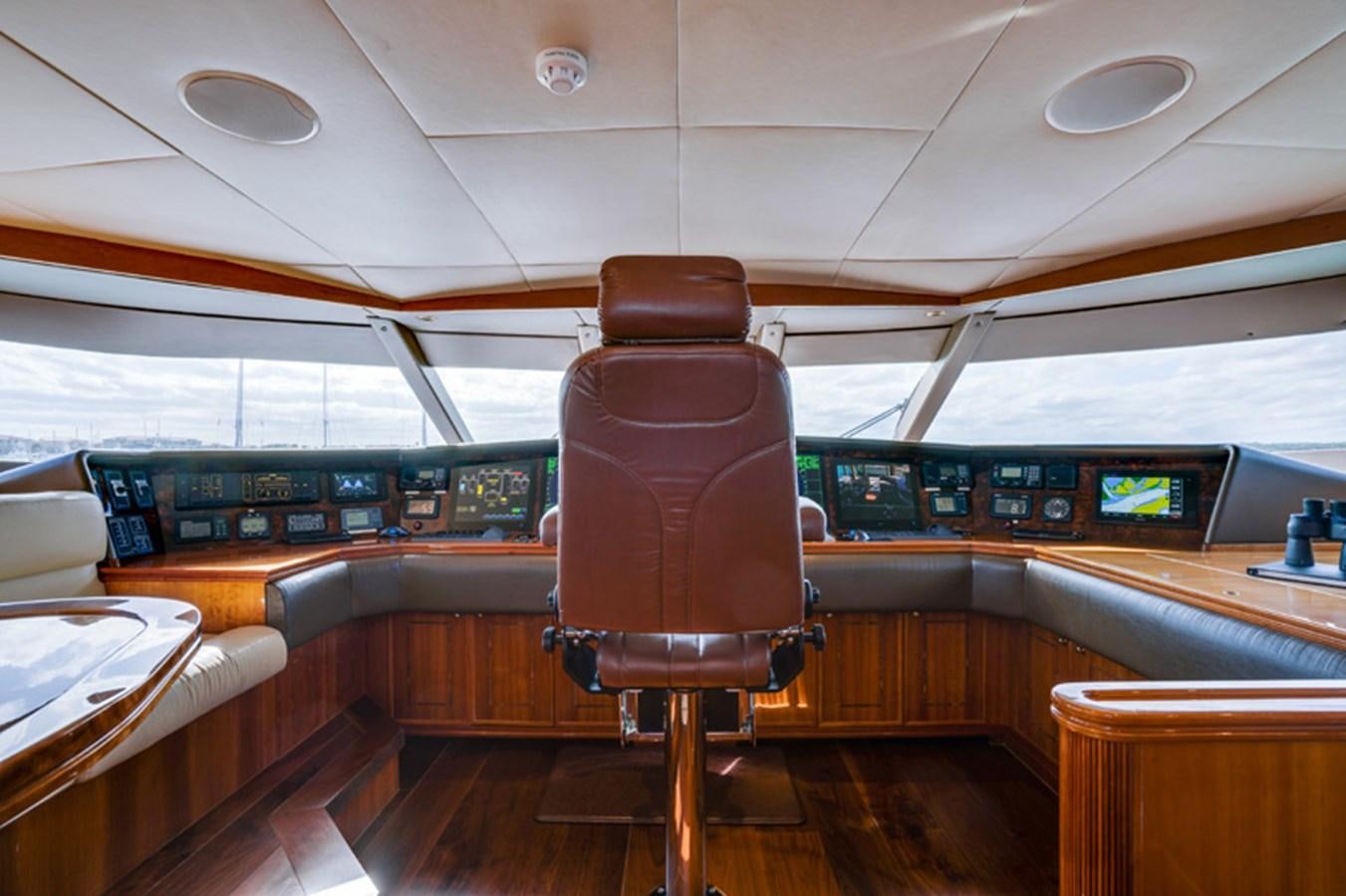 a wooden chair in a room aboard TEMPTATION Yacht for Sale