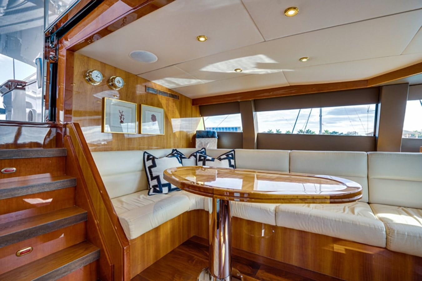 a room with a couch and a table aboard TEMPTATION Yacht for Sale