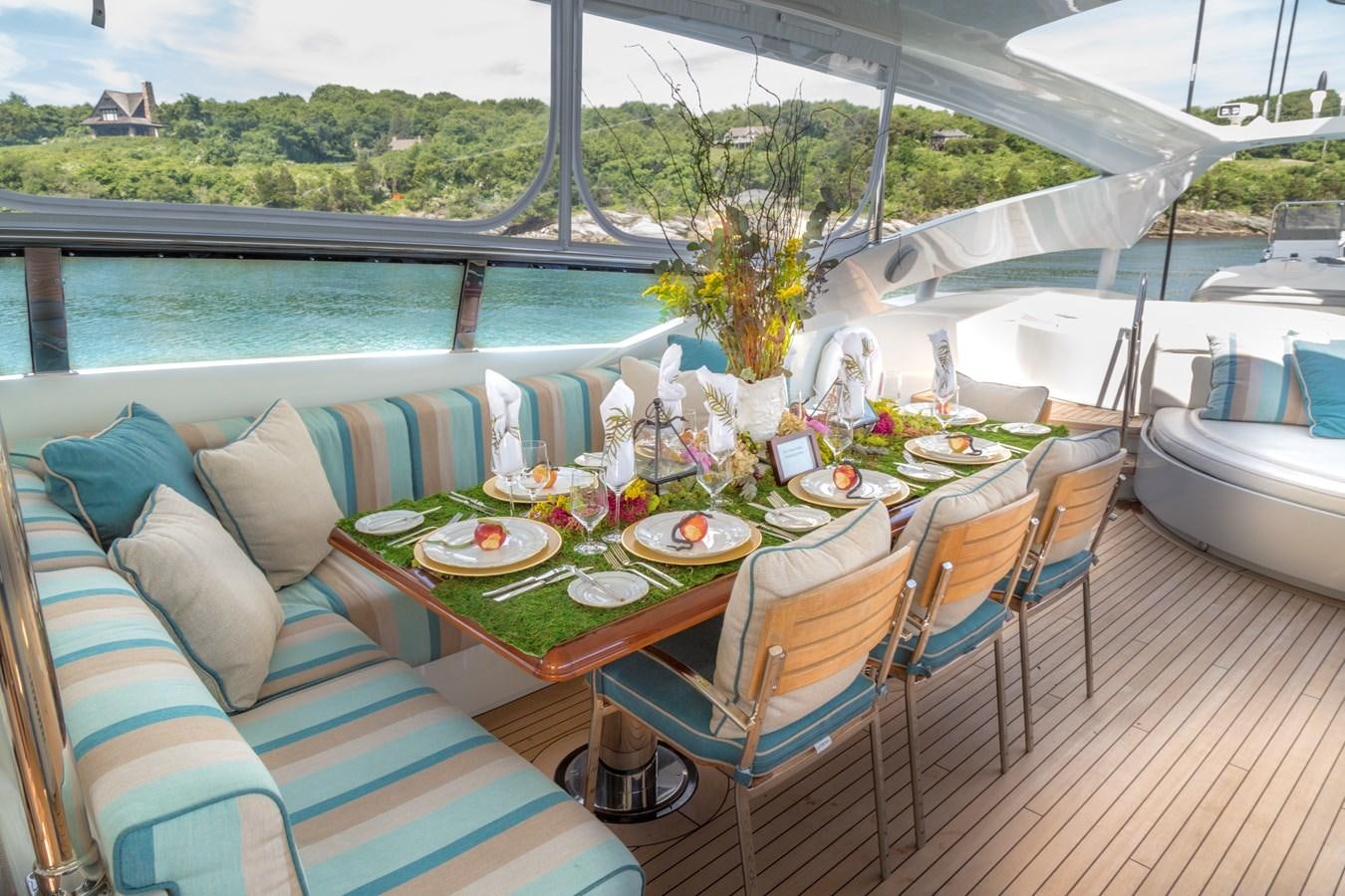 a table set for a meal on a boat aboard TEMPTATION Yacht for Sale