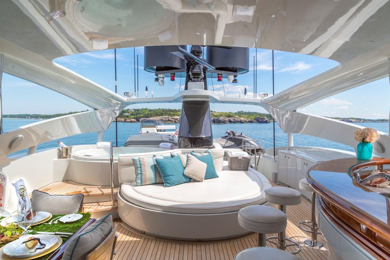 a boat with a large white bed aboard TEMPTATION Yacht for Sale