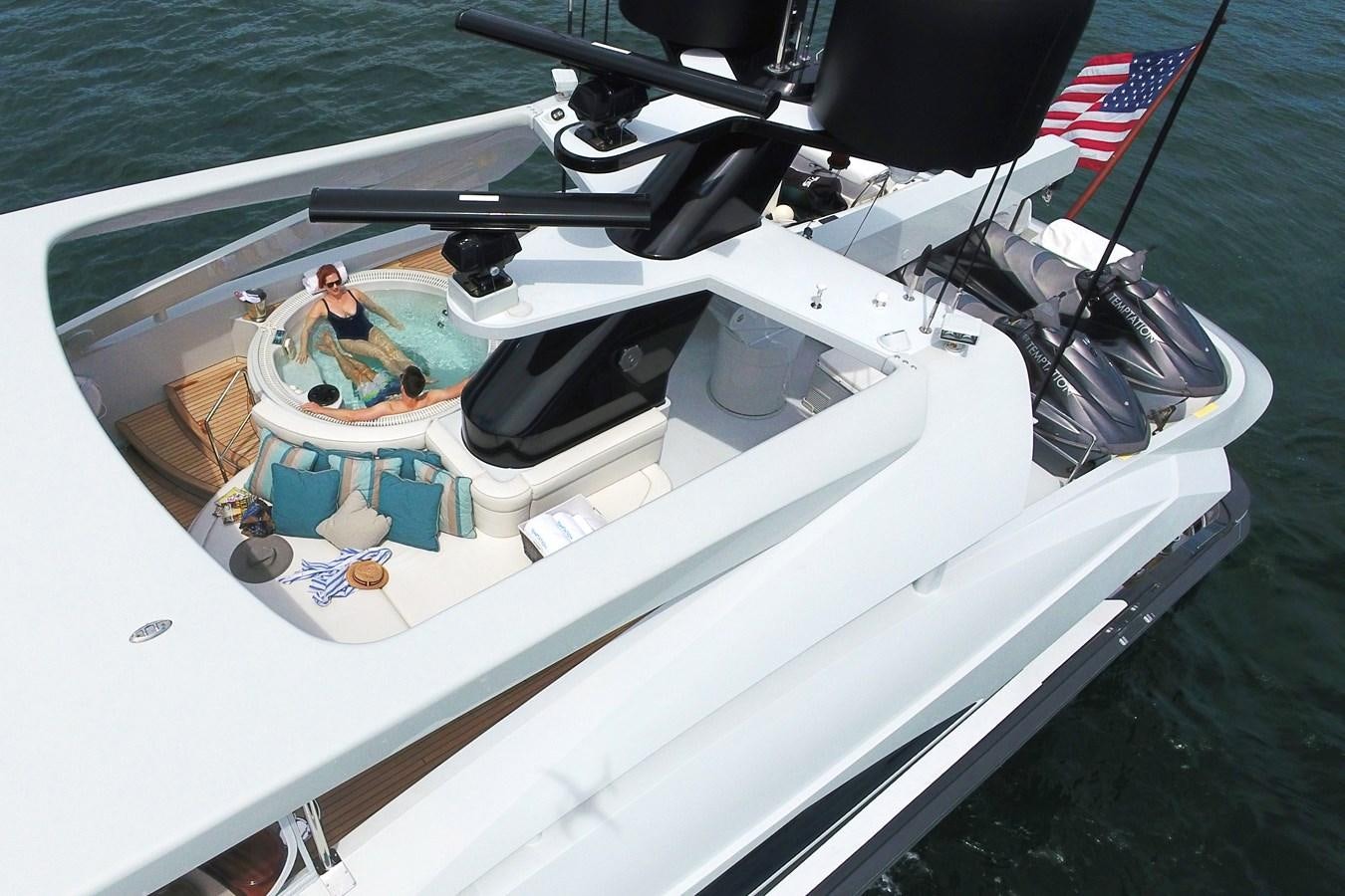 a couple of people in a boat aboard TEMPTATION Yacht for Sale