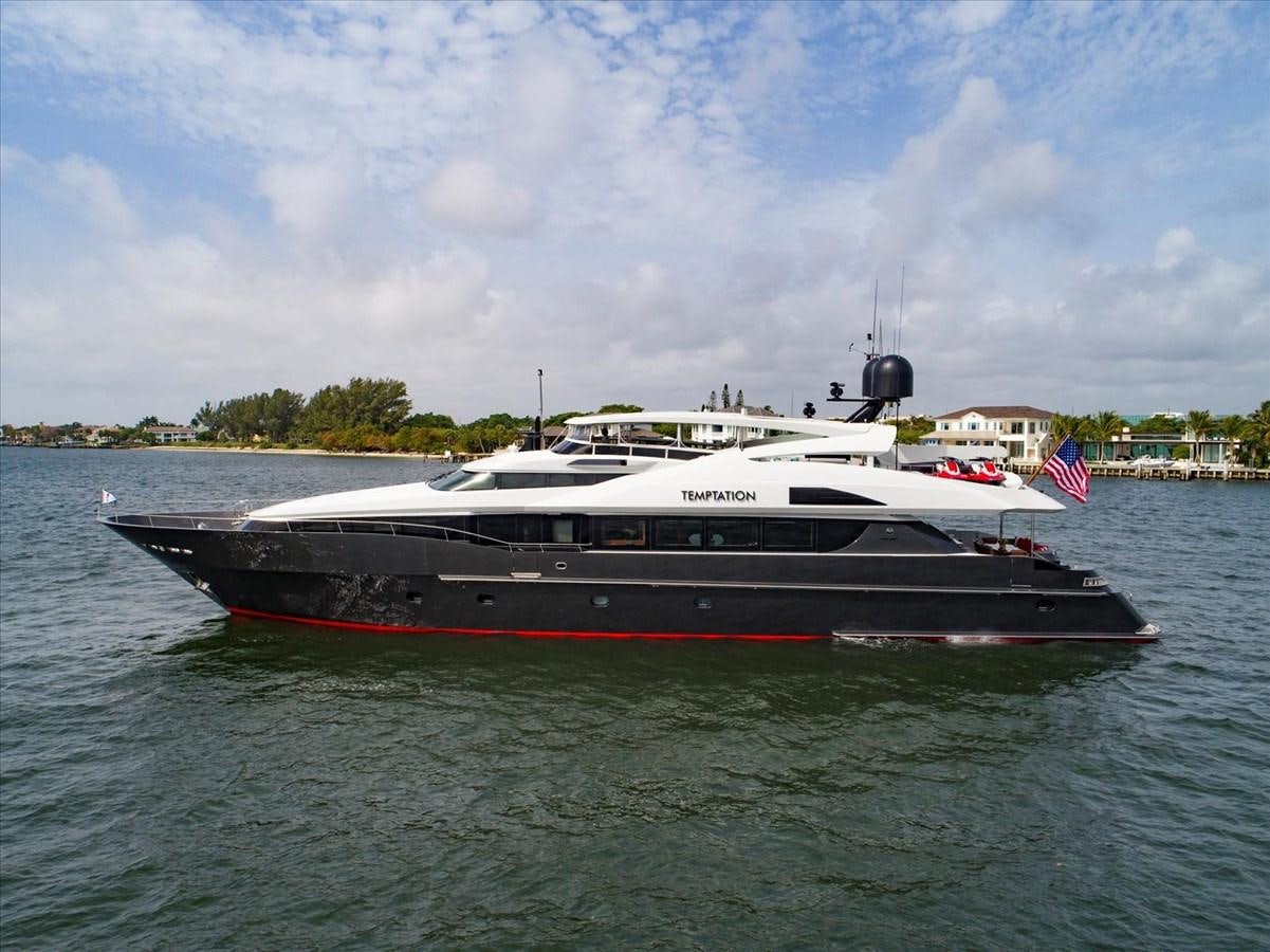 a large boat in the water aboard TEMPTATION Yacht for Sale