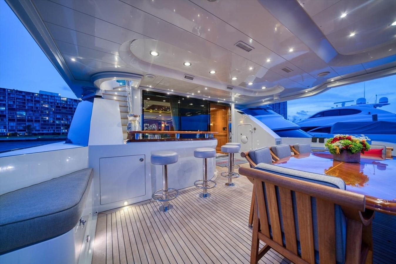 inside of a building with tables and chairs aboard TEMPTATION Yacht for Sale