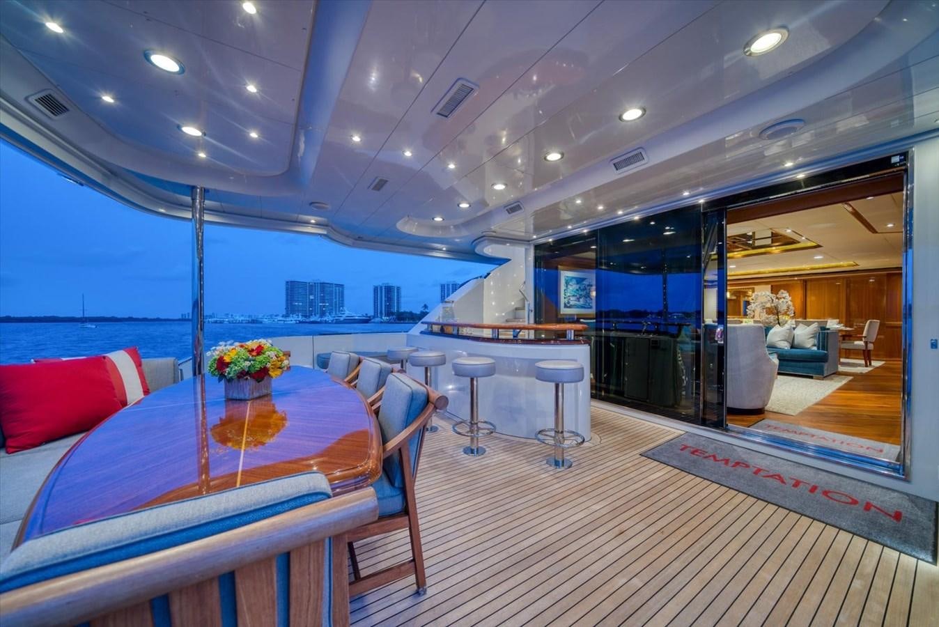 a room with a table and chairs aboard TEMPTATION Yacht for Sale