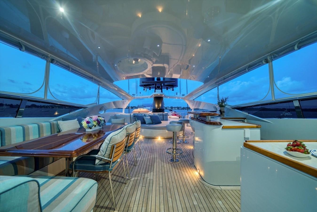 inside of a building with a table and chairs aboard TEMPTATION Yacht for Sale