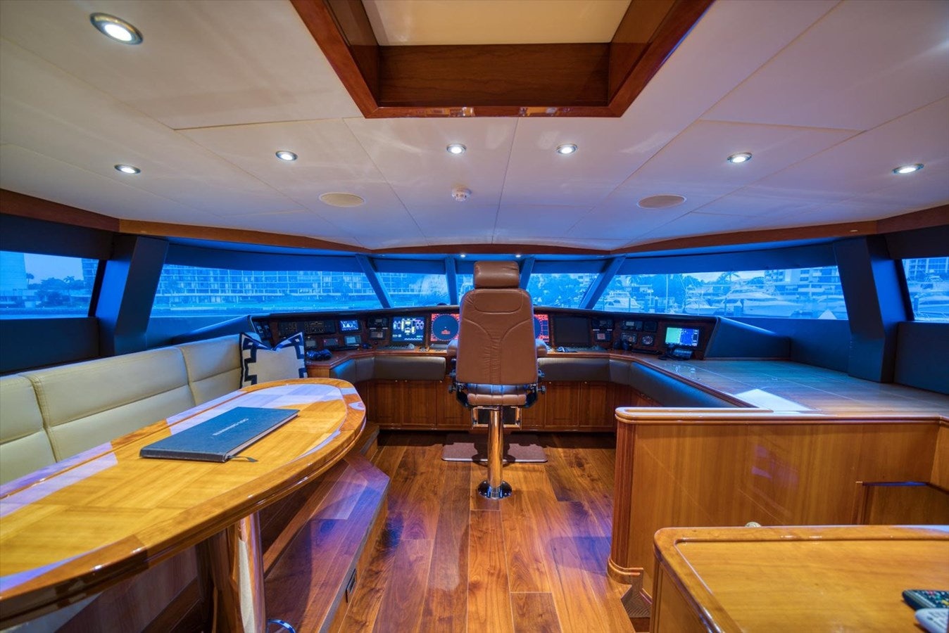 a room with a desk and a laptop on a table aboard TEMPTATION Yacht for Sale