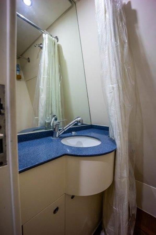 a bathroom with a sink and a mirror aboard NYHAVEN Yacht for Sale