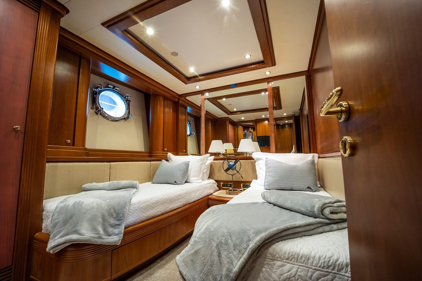 a room with two beds aboard NYHAVEN Yacht for Sale