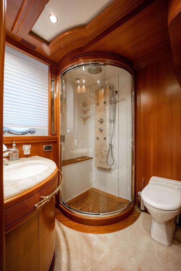 a bathroom with a shower unit and a toilet aboard NYHAVEN Yacht for Sale