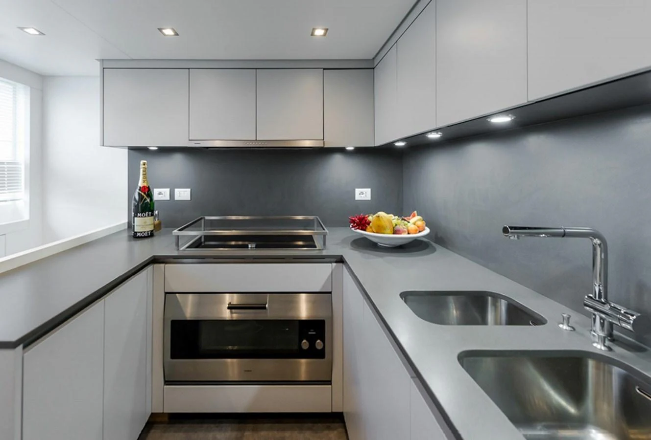 a kitchen with a bowl of fruit aboard SANLORENZO SD112 Yacht for Sale