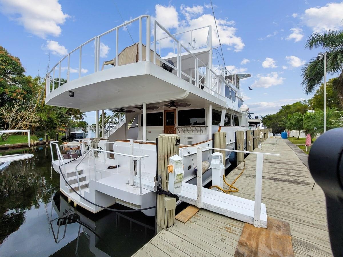 a boat docked at a pier aboard MOVIE SET Yacht for Sale