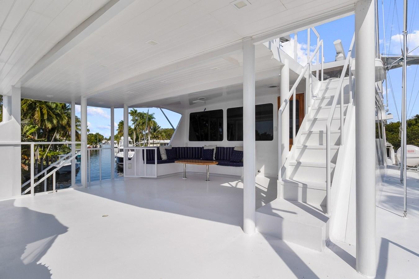 a white building with a staircase aboard MOVIE SET Yacht for Sale