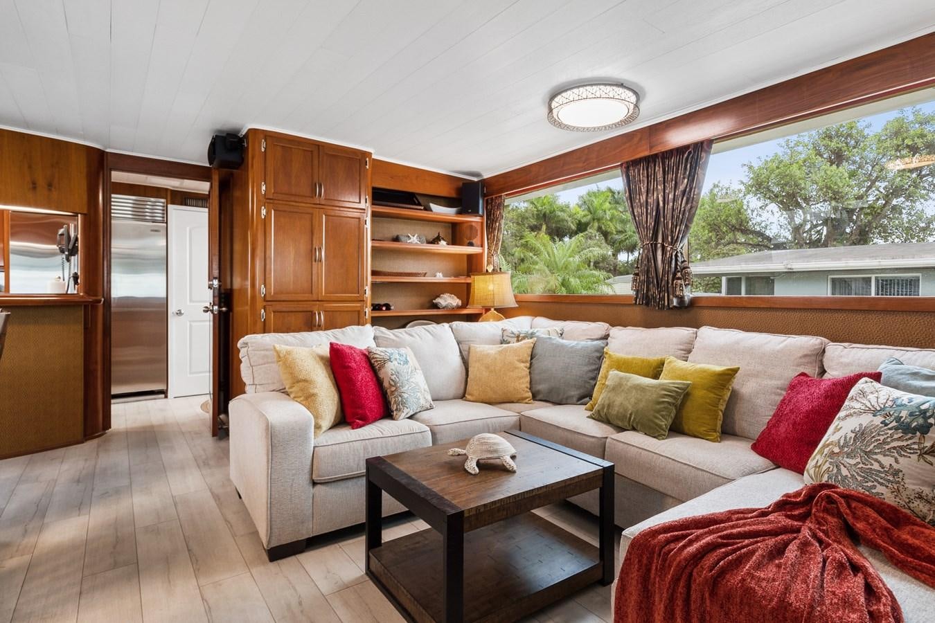 a living room with a couch and a table aboard MOVIE SET Yacht for Sale