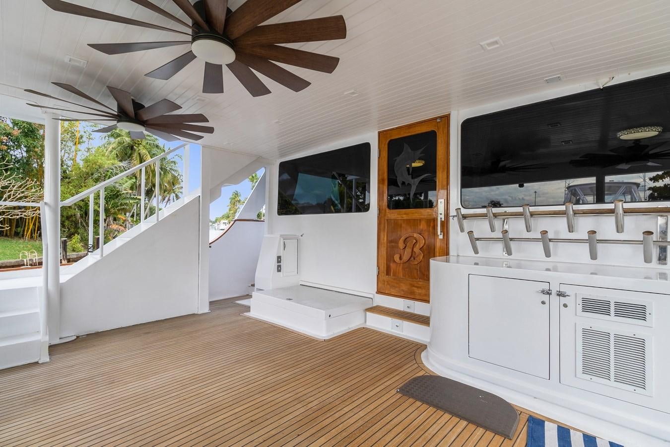a large open kitchen with a ceiling fan aboard MOVIE SET Yacht for Sale