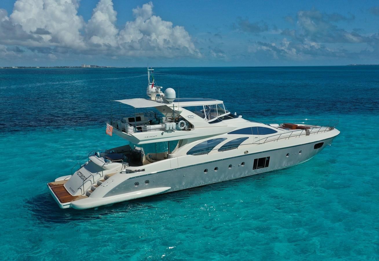 a white yacht in the ocean aboard VICTORIOUS Yacht for Sale