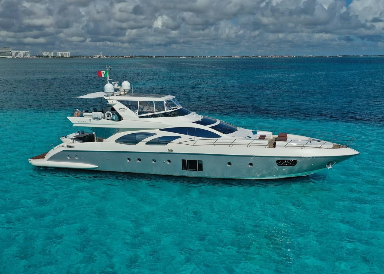 a white yacht in the water aboard VICTORIOUS Yacht for Sale