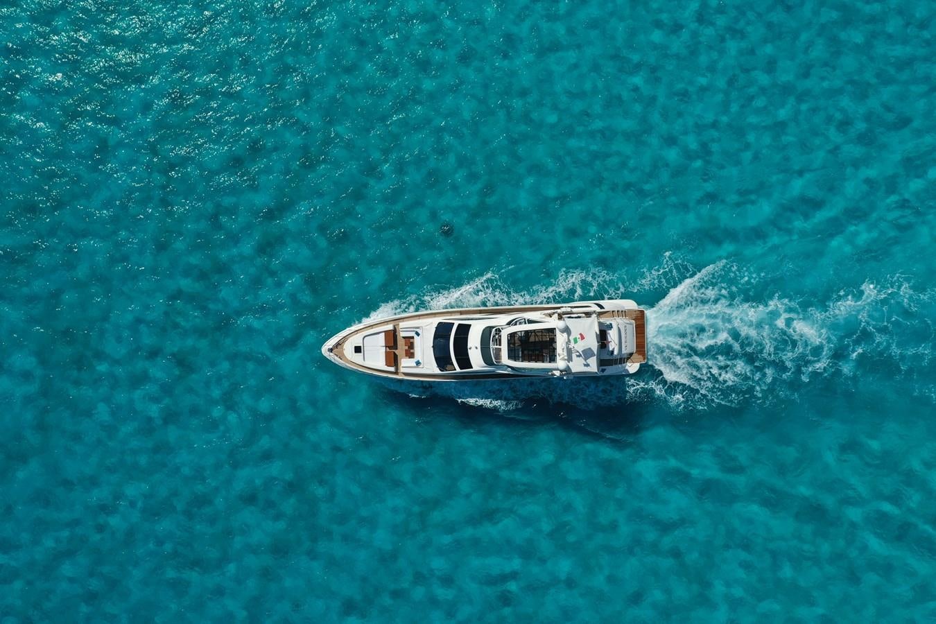 a white boat in the water aboard VICTORIOUS Yacht for Sale