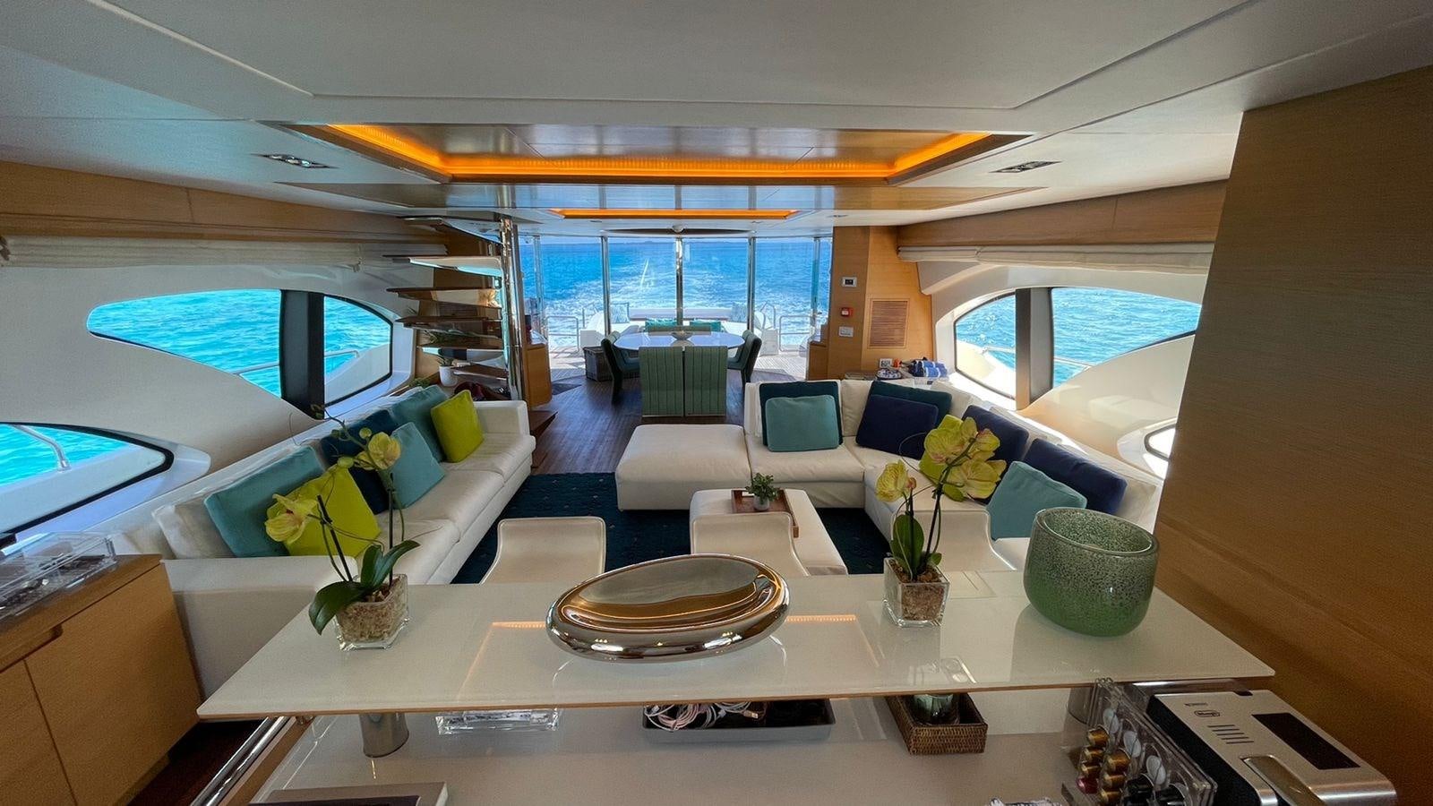 a room with a table and chairs aboard VICTORIOUS Yacht for Sale