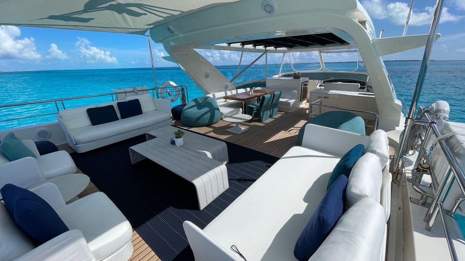 a boat with a table and chairs on it aboard VICTORIOUS Yacht for Sale