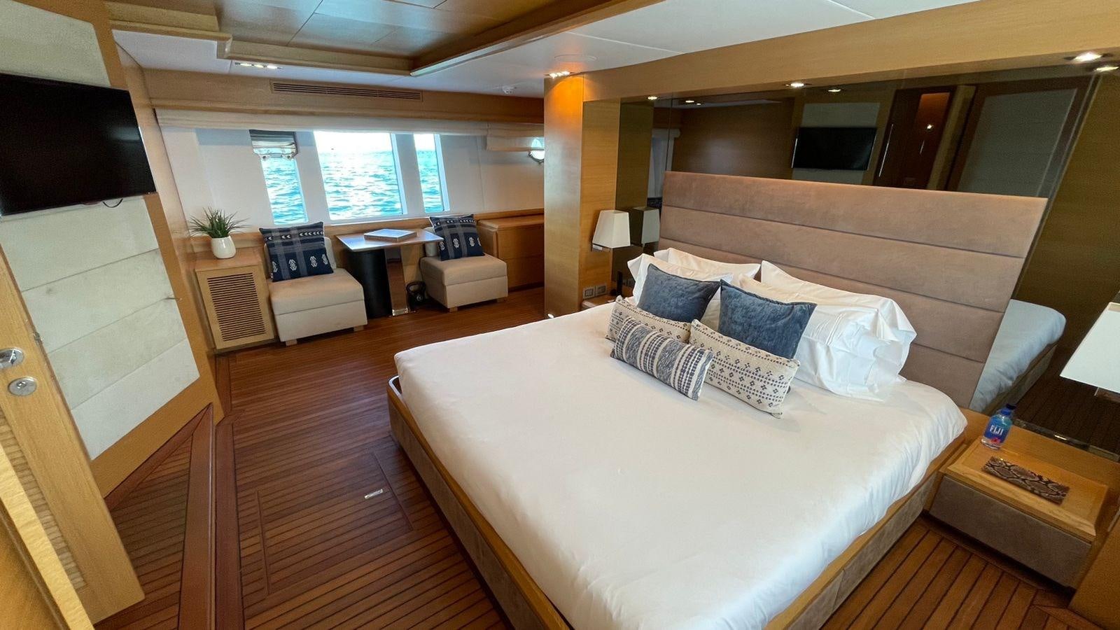 a large bed in a room aboard VICTORIOUS Yacht for Sale