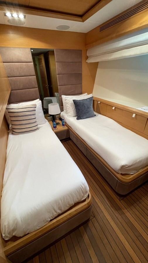 a couple of beds in a hotel room aboard VICTORIOUS Yacht for Sale
