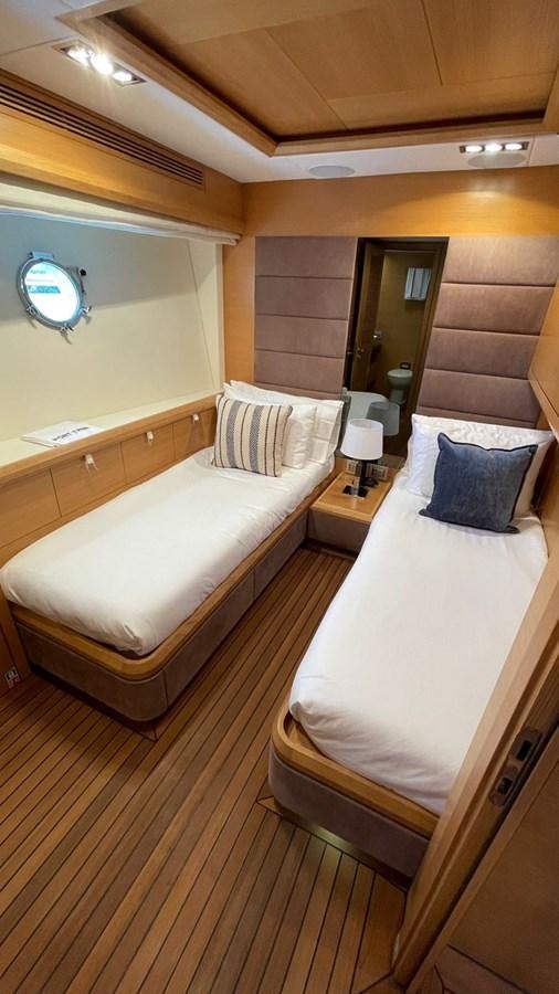 a room with two beds aboard VICTORIOUS Yacht for Sale