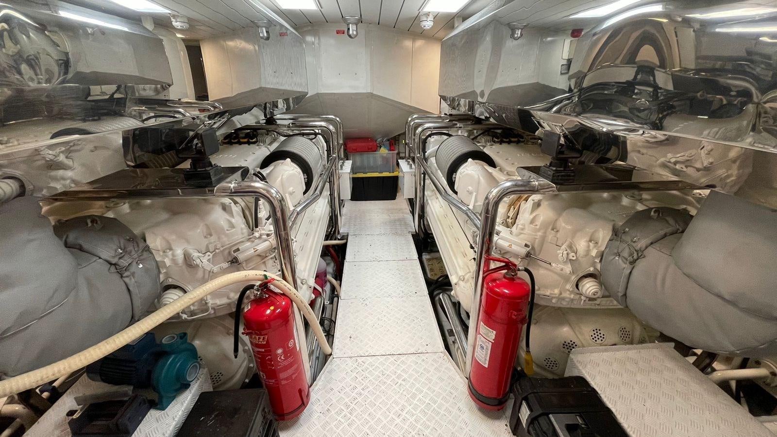 a car with a red can in a garage aboard VICTORIOUS Yacht for Sale