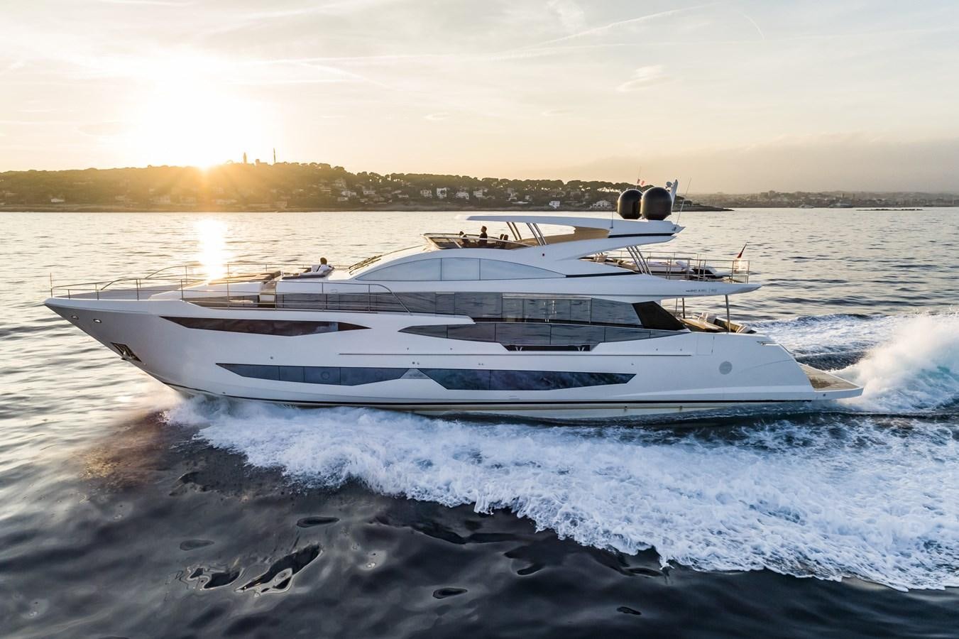 a white boat on the water aboard AMIRA Yacht for Sale