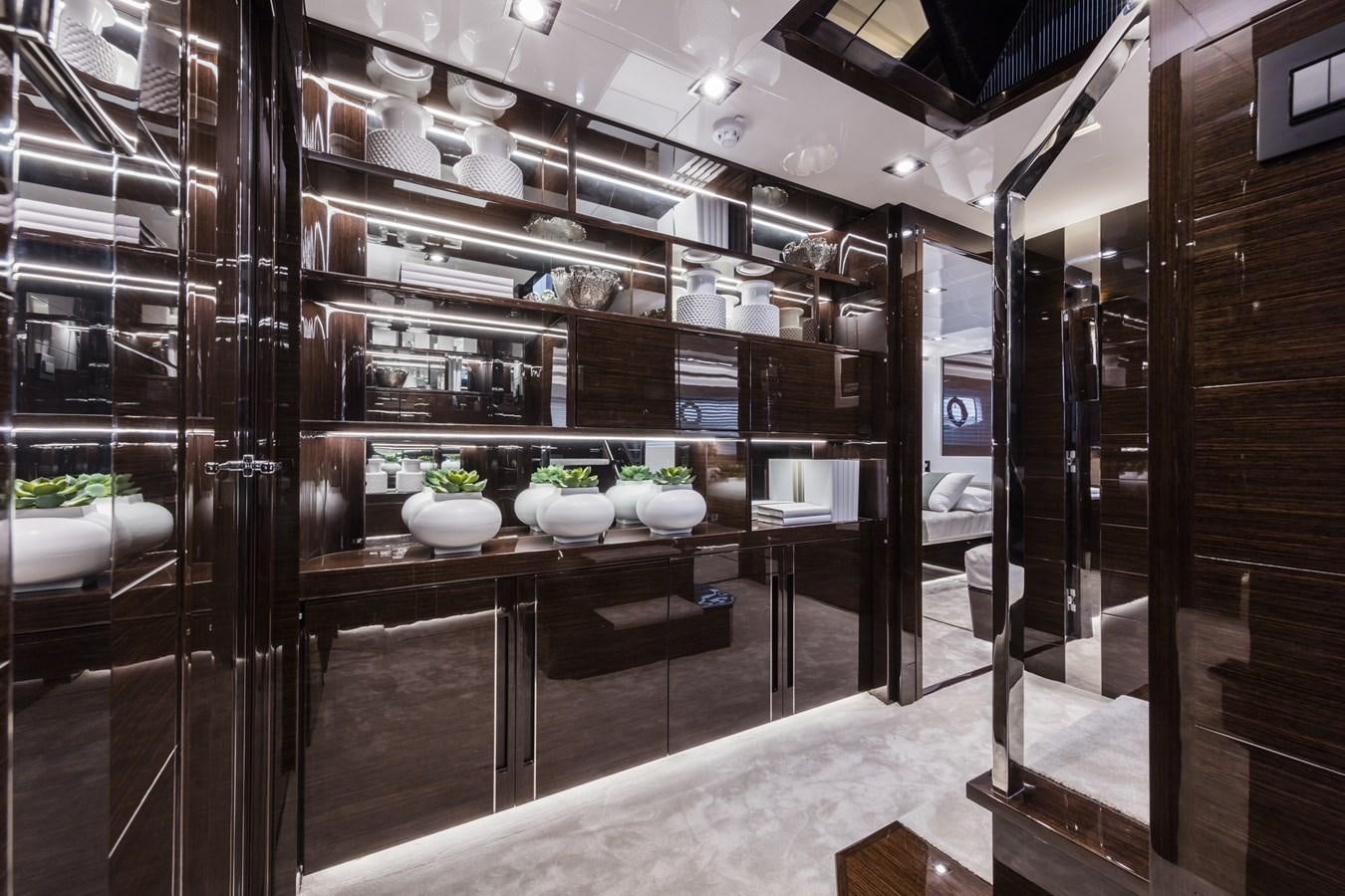 a large kitchen with shelves aboard AMIRA Yacht for Sale