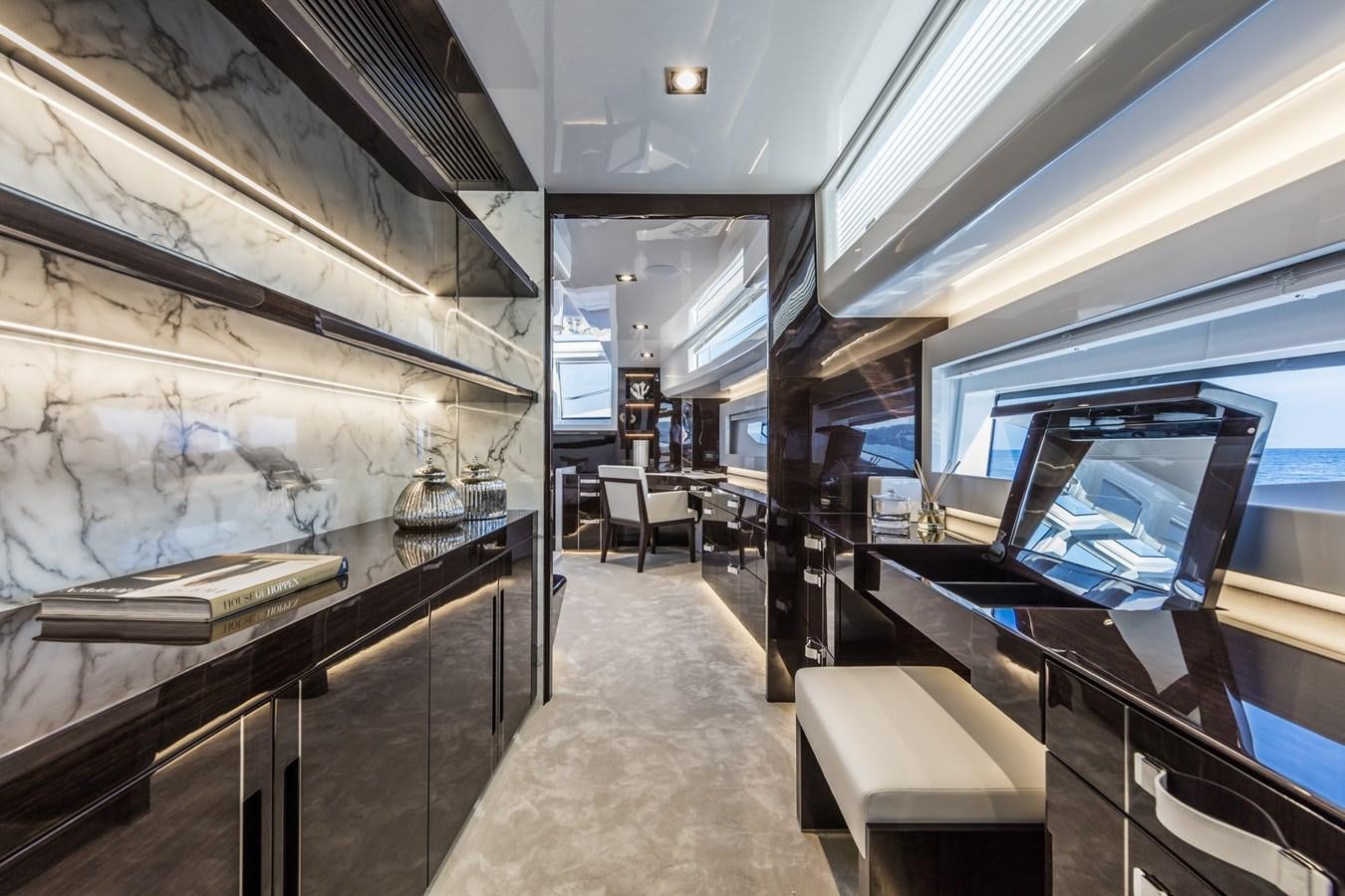 a room with a large wall and a large window aboard AMIRA Yacht for Sale