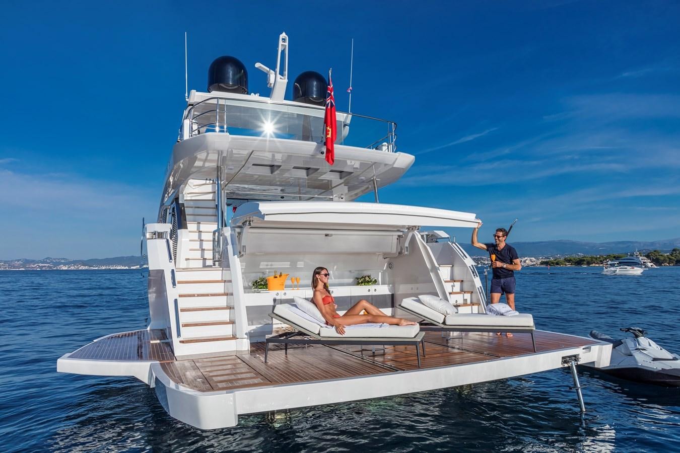 a couple of people sitting on a boat in the water aboard AMIRA Yacht for Sale
