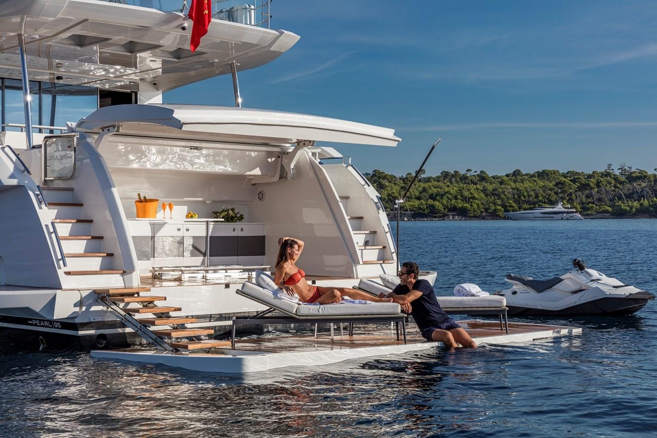 a couple of people on a boat aboard AMIRA Yacht for Sale