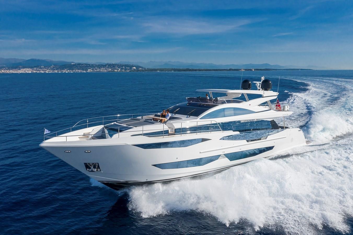 a white yacht on the water aboard AMIRA Yacht for Sale