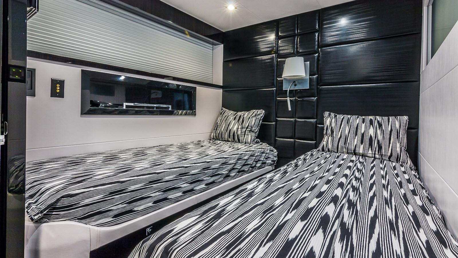 a room with a bed and a television aboard SEXY Yacht for Sale