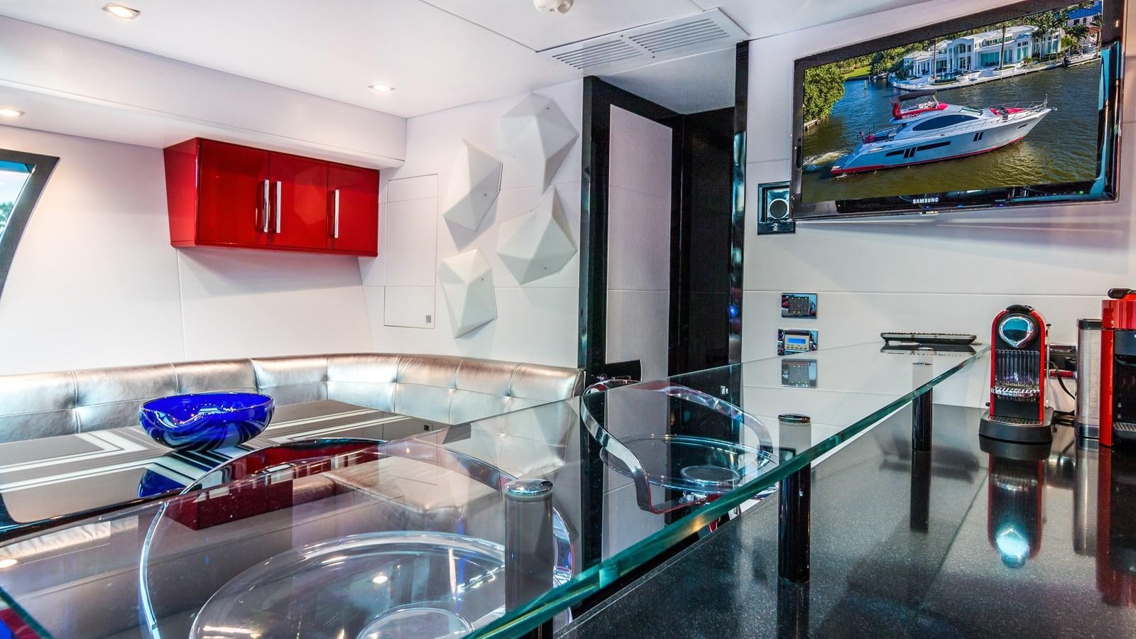 a large kitchen with a large glass display case aboard SEXY Yacht for Sale