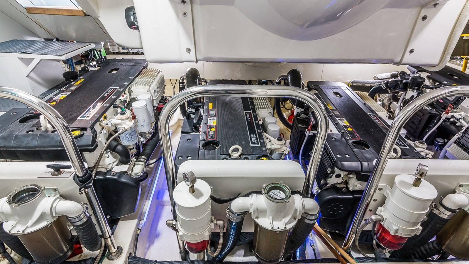 a car with a large engine aboard SEXY Yacht for Sale