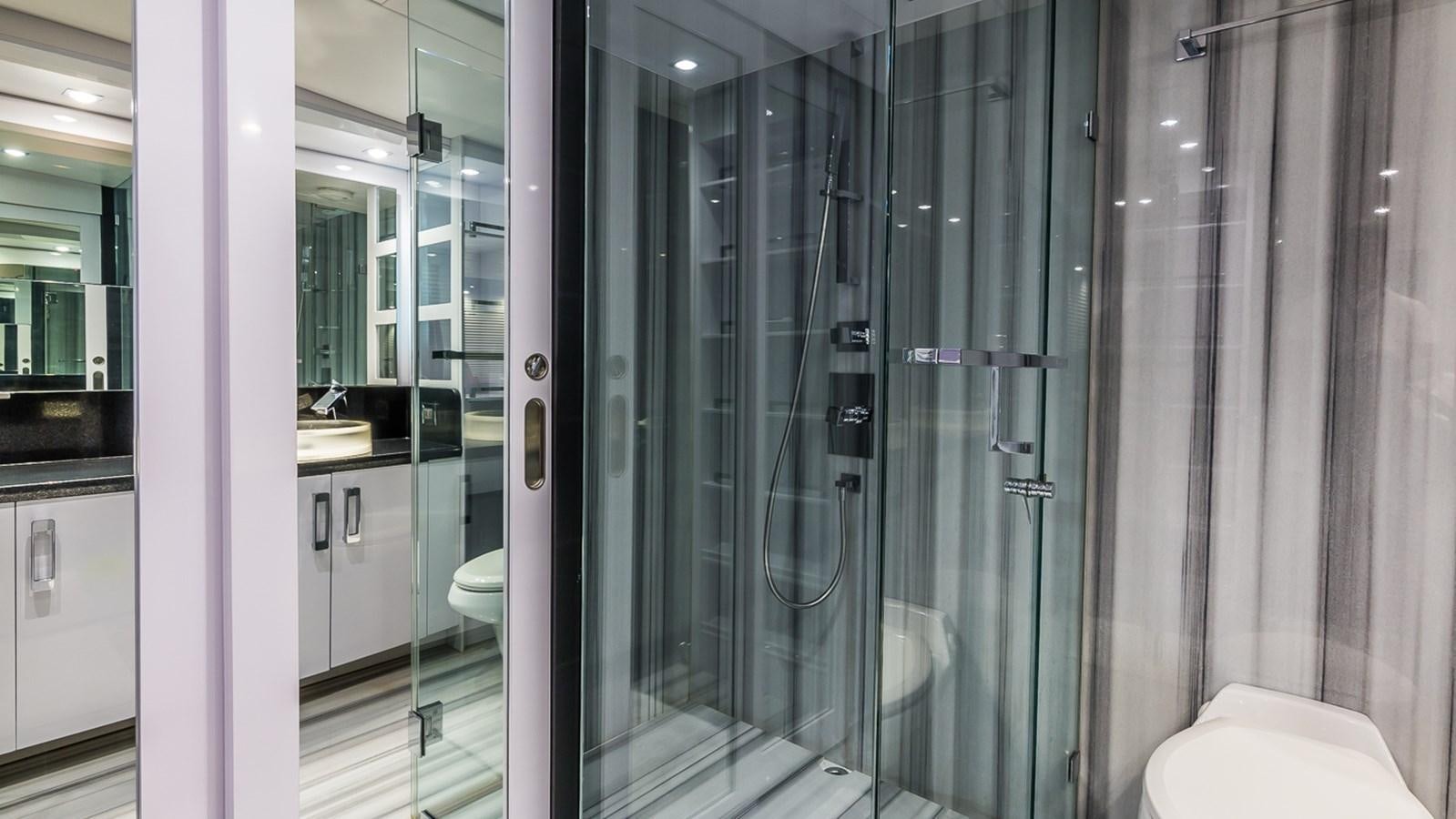 a bathroom with glass walls aboard SEXY Yacht for Sale