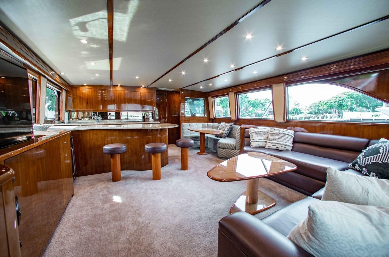 a living room with a large window aboard CURIOUS GEORGE Yacht for Sale