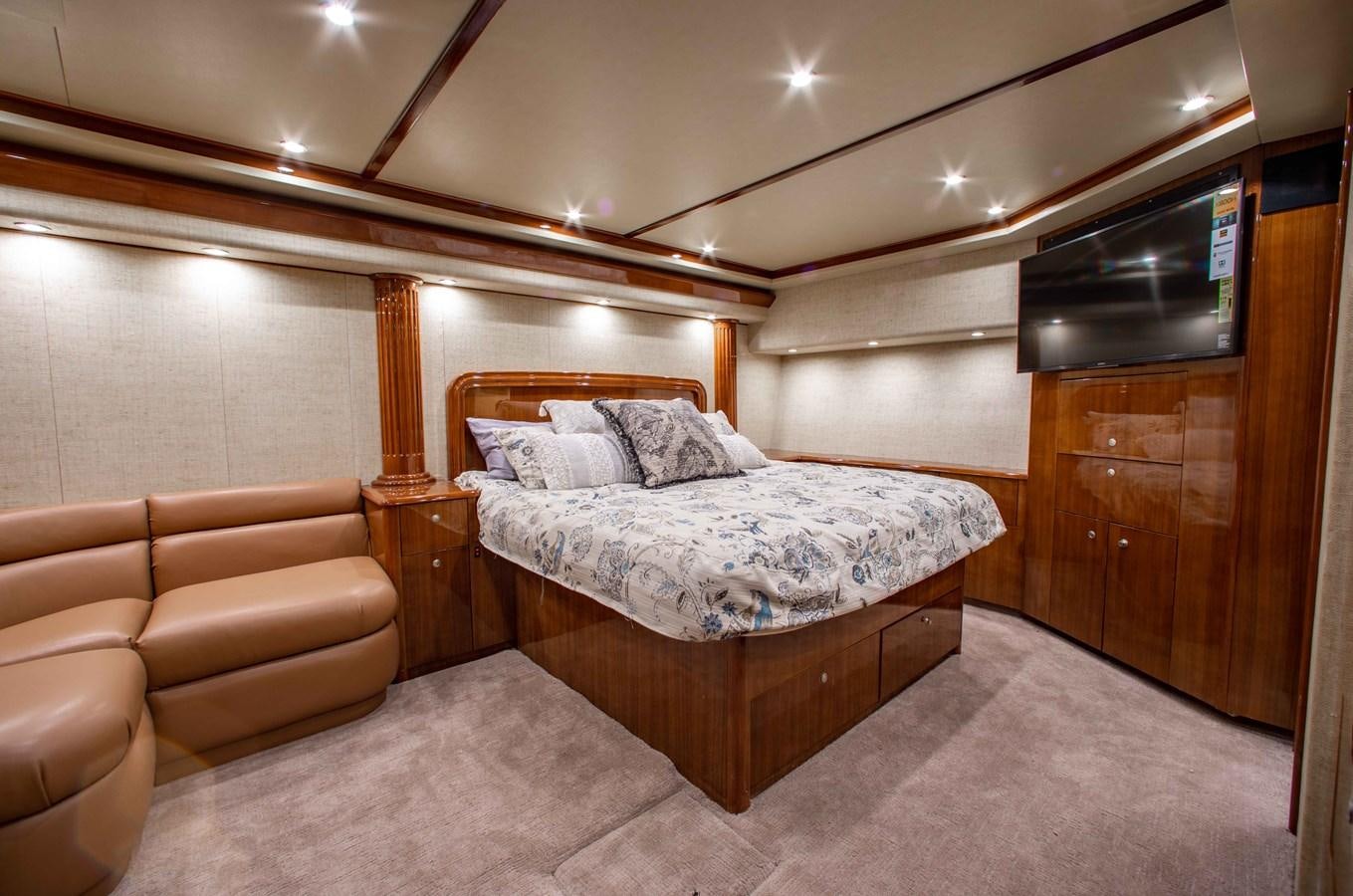 a bed in a room aboard CURIOUS GEORGE Yacht for Sale