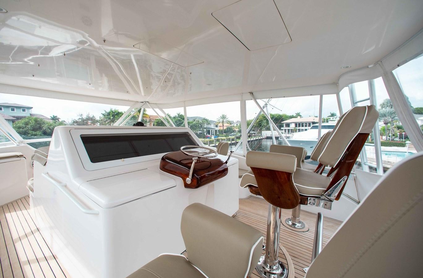 a boat with a glass of wine and a laptop on it aboard CURIOUS GEORGE Yacht for Sale