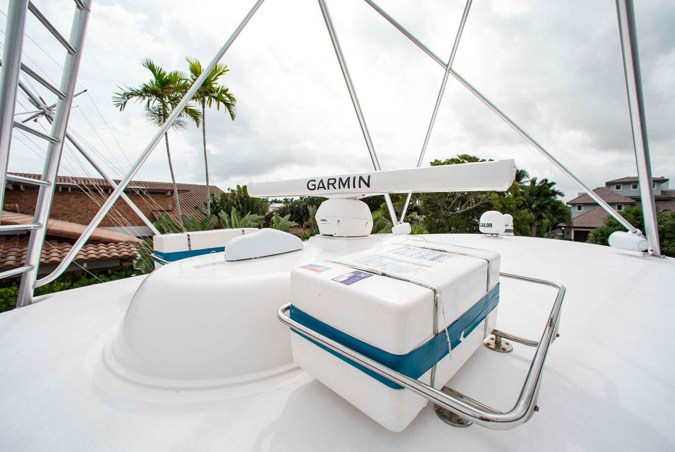 a white boat on a white surface aboard CURIOUS GEORGE Yacht for Sale