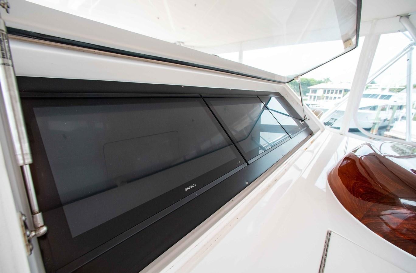 a tv on a table aboard CURIOUS GEORGE Yacht for Sale