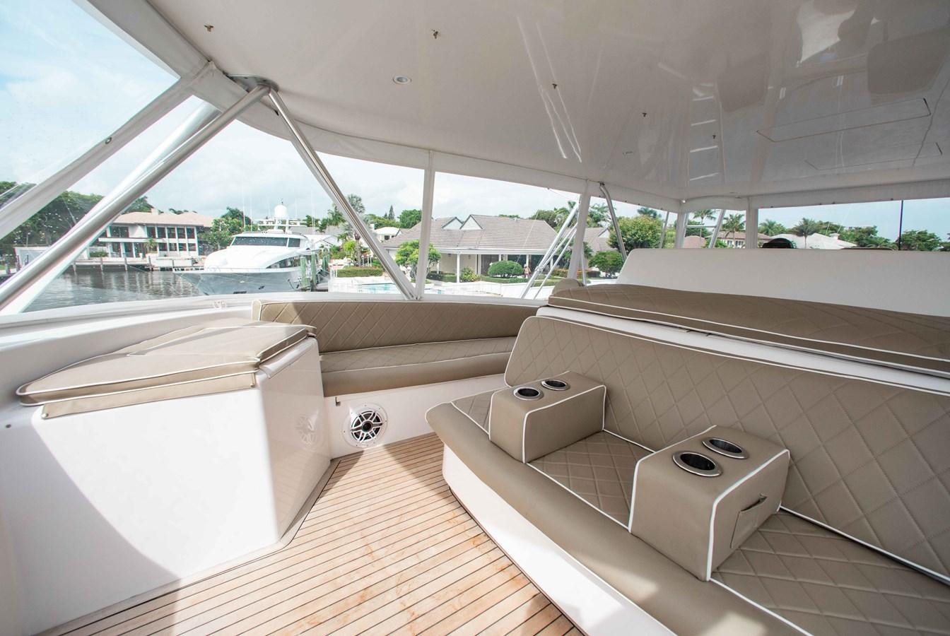 a room with a bed and a window aboard CURIOUS GEORGE Yacht for Sale